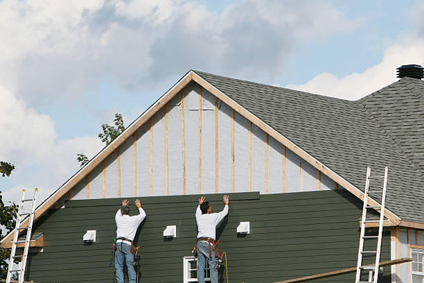 Professional Siding Installation technician working in East Canton, OH